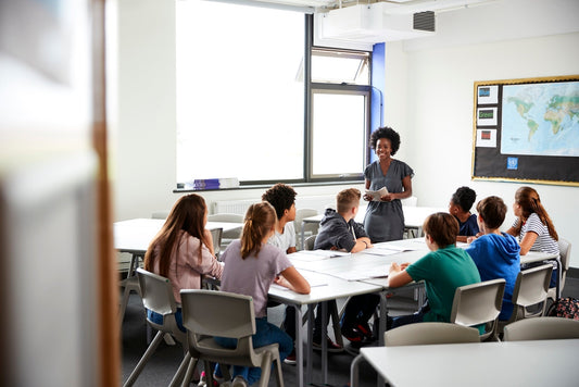 Diverse classroom sitting in a group